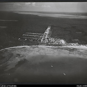 Aerial view of bay and Methodist Mission settlement, Elcho Island, Northern Territory, 1958?